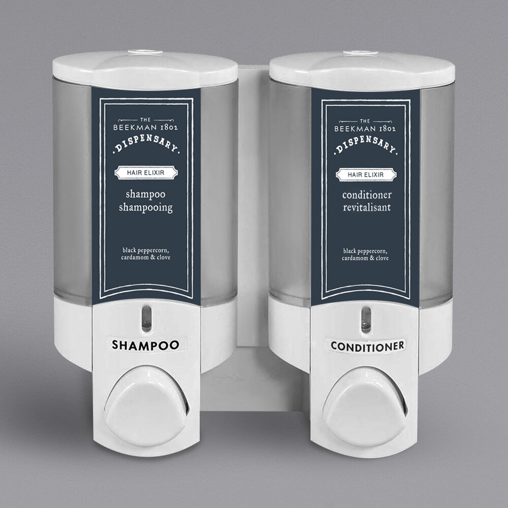 Dispenser Amenities 36250-BKMN Aviva 20 oz. White 2-Chamber Wall Mounted Locking Soap Dispenser with Translucent Bottles and Beekman Logo